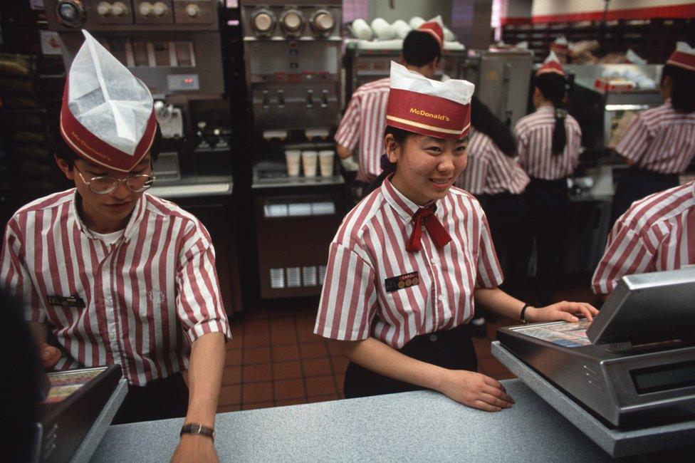 Staff at the first McDonald's restaurant in China, which opened in Shenzhen in 1990