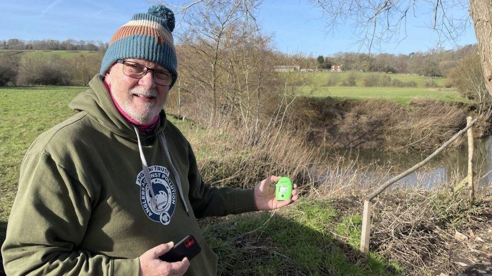 Angler Ian Tucker standing in front of the River Medway