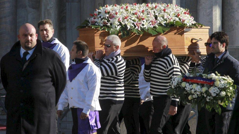 The coffin containing the body of Valeria Solesin is carried by gondoliers during her funeral