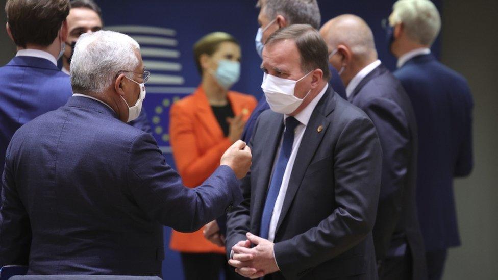 Portugal's Prime Minister Antonio Costa (L) speaks with Sweden's Prime Minister Stefan Lofven