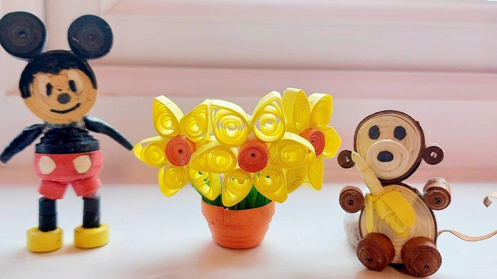 Quilled models of Mickey Mouse and daffodils