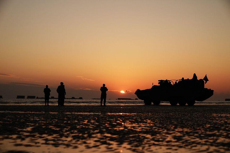 People attend the ceremony on Gold Beach in Arromanches in Normandy, France, to commemorate the 80th anniversary of the D-Day landings. June 6, 2024. 