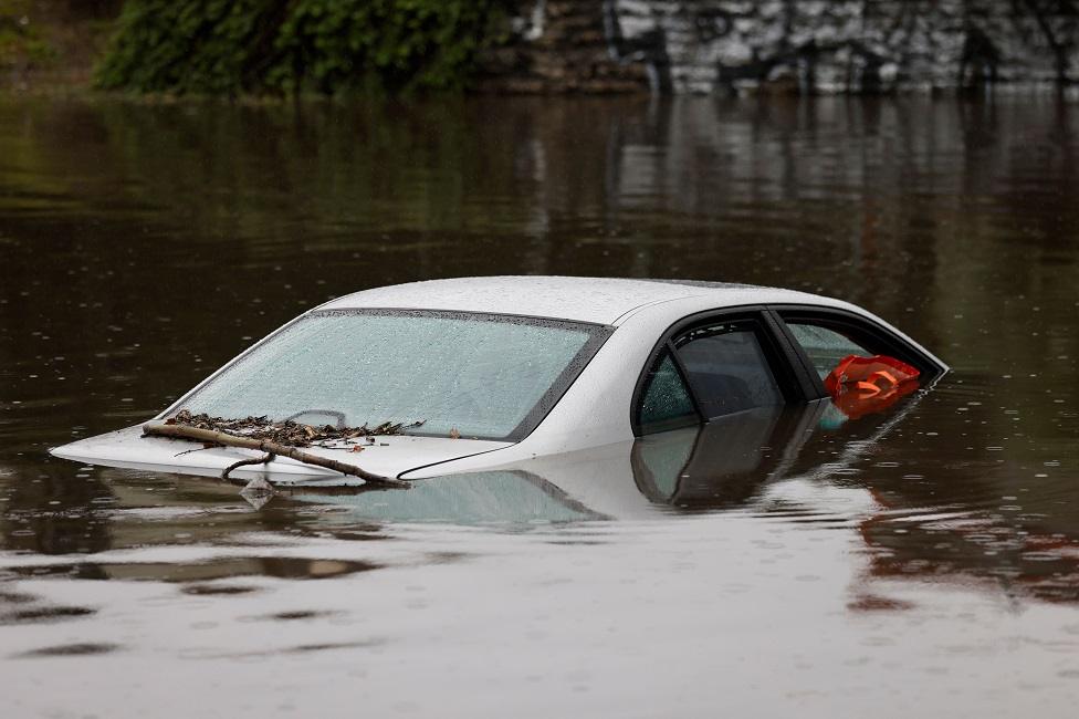 A car sits fully submerged in water after rain from an atmospheric river storm hit hours earlier in Long Beach, California, USA, 01 February 2024. The National Weather Service issued a flood advisory early 01 February morning for a large part of Los Angeles County and eastern Ventura County. This storm is the first of back-to-back, major atmospheric river storms, with the second expected to hit southern California on 04 February.