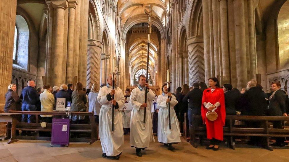 Mourners look on during the service at Durham Cathedral