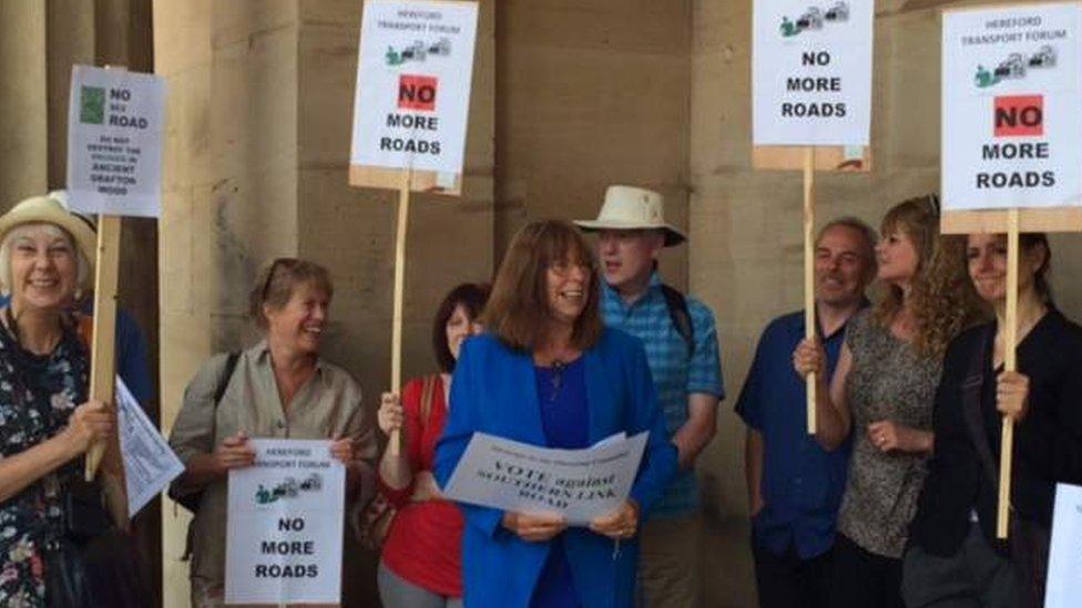 Protesters outside the meeting