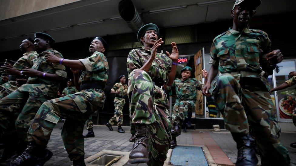 Supporters of the African National Congress (ANC) outside the ruling party's headquarters in Johannesburg