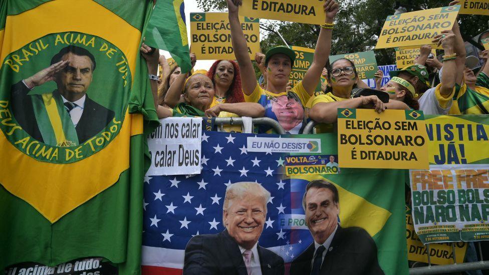 Supporters of Brazil's former president Jair Bolsonaro, hold allusive signs a demonstration during Independence Day, in Sao Paulo, Brazil on September 7, 2025.