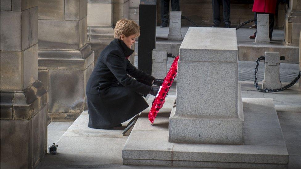 sturgeon laying wreath