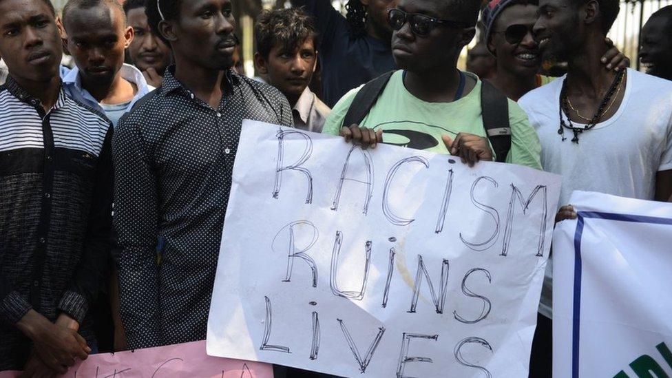 Members of the African Students Association hold placards during a protest in Hyderabad on February 6, 2016