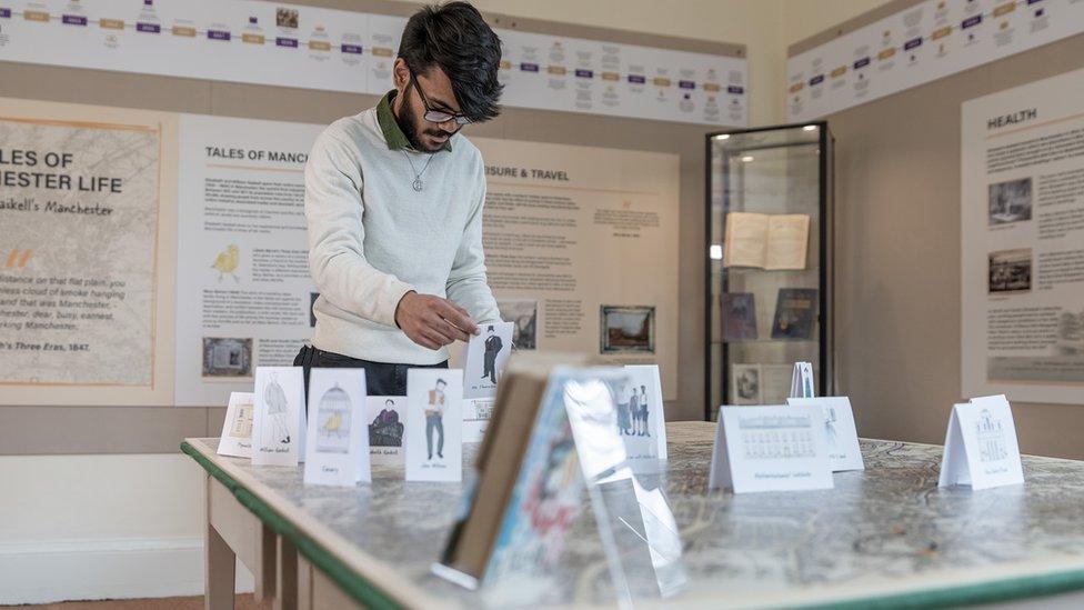 Man looks at map of locations that inspired Elizabeth Gaskell