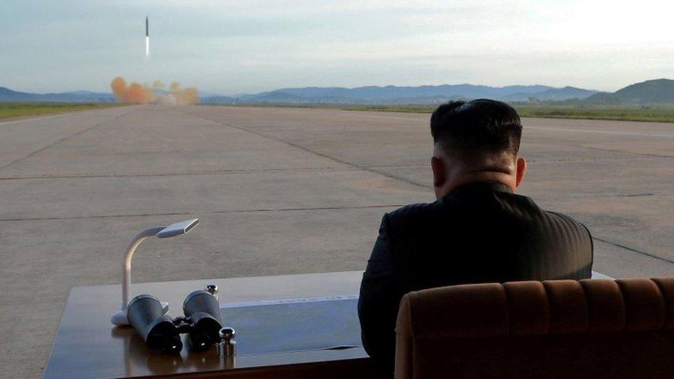 North Korean leader Kim Jong-un watches the launch of a Hwasong-12 missile in this undated photo released by North Korea's Korean Central News Agency on 16 September 2017