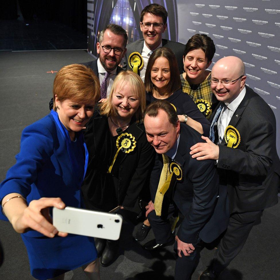 Scottish National Party (SNP) leader and Scotland's First Minister Nicola Sturgeon (L) takes a selfie photograph with her Glasgow MPs