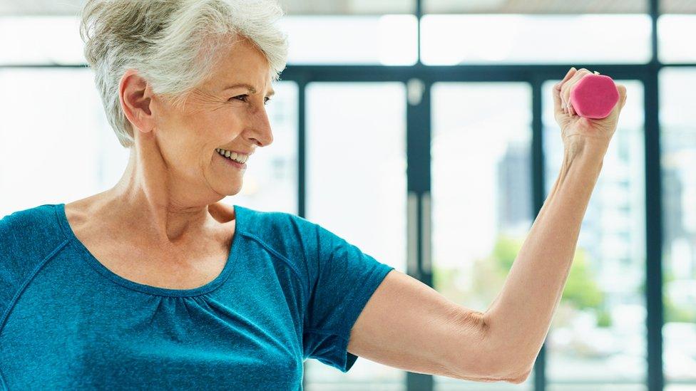 Woman using weights