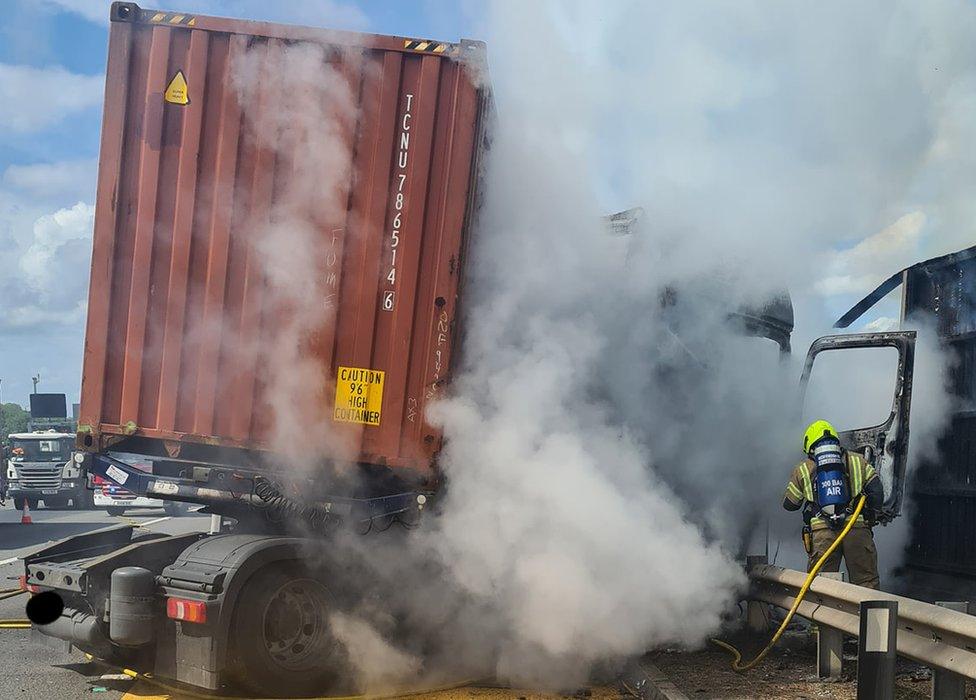 Firefighter by a lorry fire on the M1 by Luton