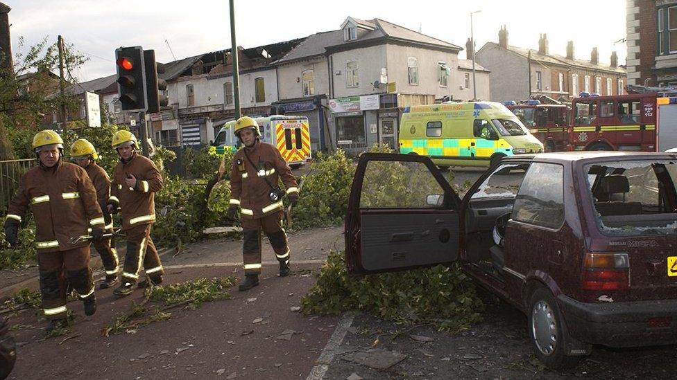 Firefighters dealing with the aftermath of a tornado in Birmingham in 2005