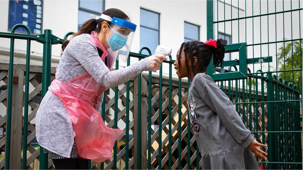 Temperature testing on a pupil at a school in London