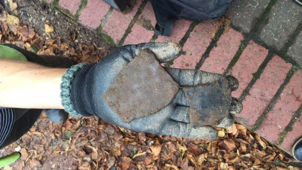 Pottery in someone's hand