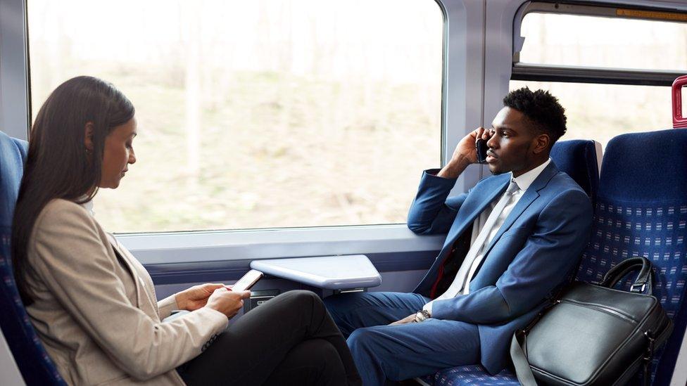 man and woman on train