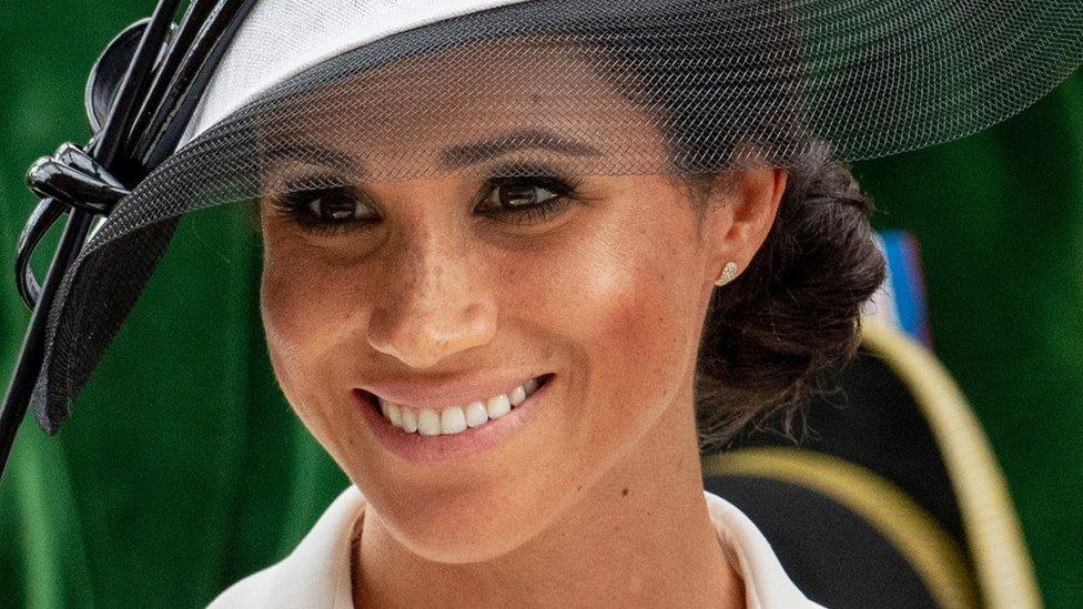 A close-up of Meghan Markle showing her freckles.