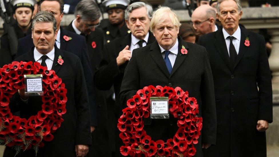 Sir Keir Starmer and Boris Johnson holding wreaths