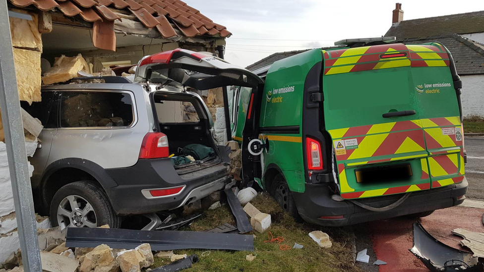 Volvo crashes into house