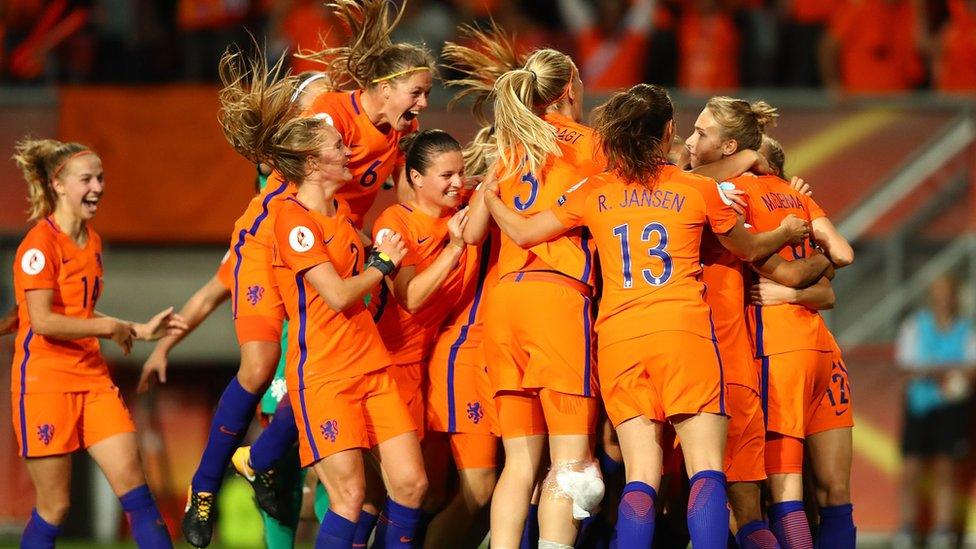 The Netherlands celebrates with team mates following the UEFA Women's Euro 2017 Semi Final match between Netherlands and England at De Grolsch Veste Stadium