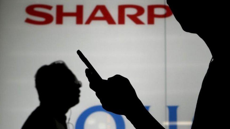 Sharp shares surge on debt relief report - BBC News