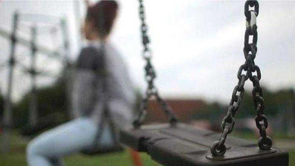 Woman on park swing