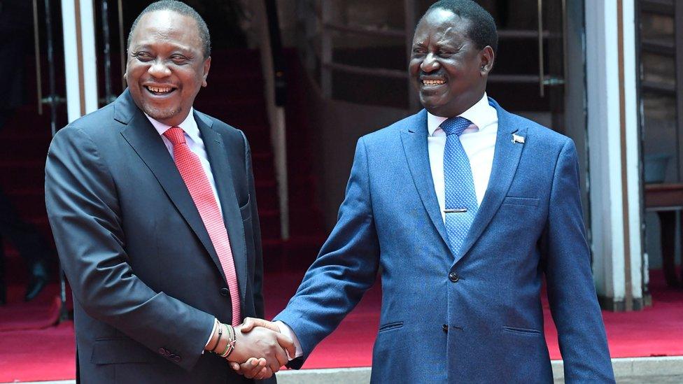 President Uhuru Kenyatta (L) and Raila Odinga (R) shaking hands in February 2018