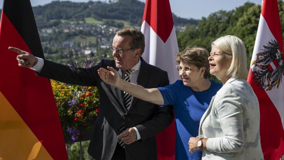 Swiss Federal Councillor Viola Amherd (C) explains the panorama to her guests Austrian Minister of Defence Klaudia Tanner (R) and German Minister of Defence Boris Pistorius