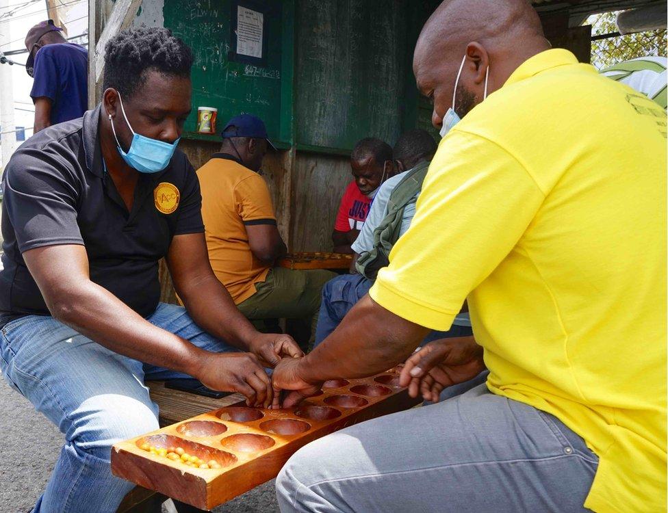 A Warri game being played in the bus station in St John's