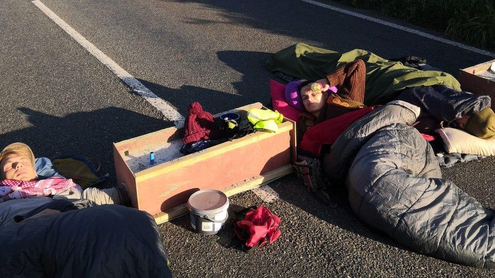 Protestors lying on the road