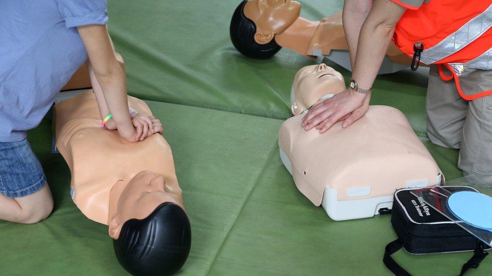 Children being taught CPR