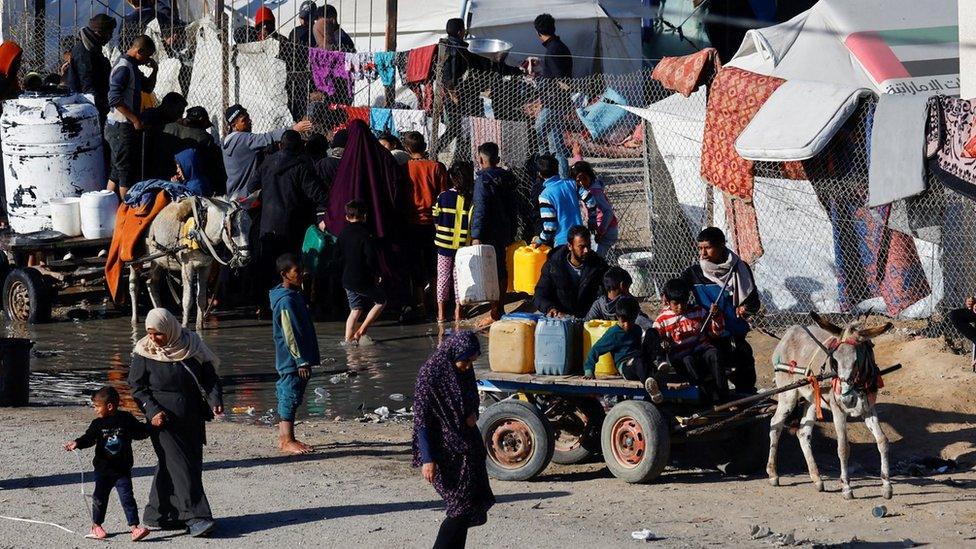 Displaced Palestinians shelter at a tented camp in Rafah, in the southern Gaza Strip (18 January 2024)