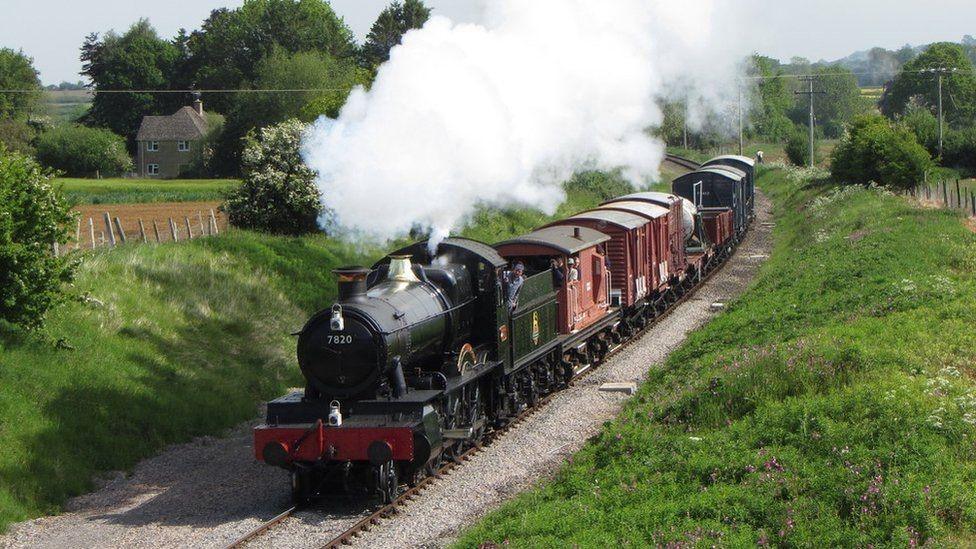 Gloucestershire and Warwickshire Steam Railway train travelling through the Cotswolds