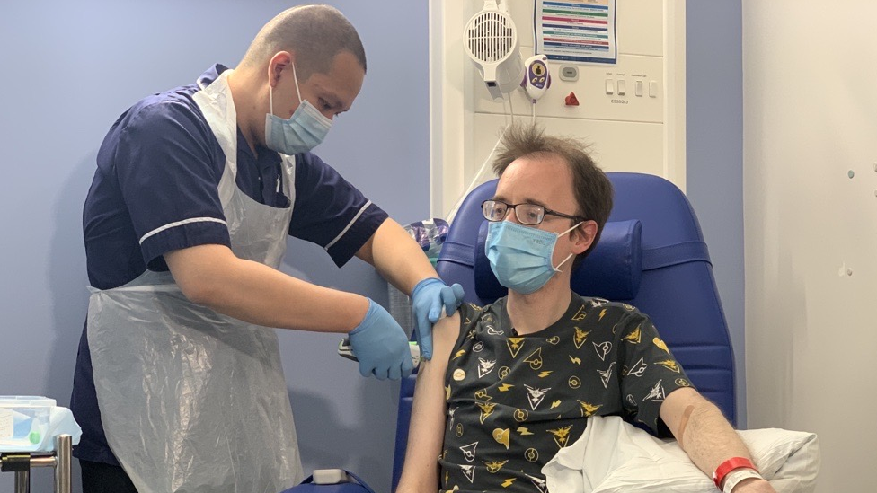 Chris Pittock getting a needle-free vaccination