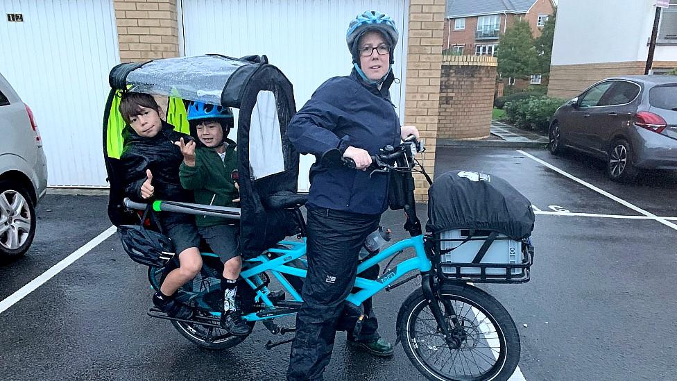 Gemma Loveless with her two children on the cargo bike