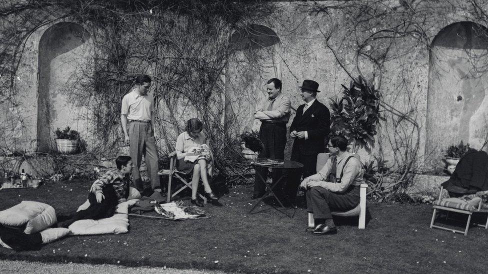 Lord Berners entertaining Frederick Aston (far left) and Gertrude Stein (right) at Easter 1939