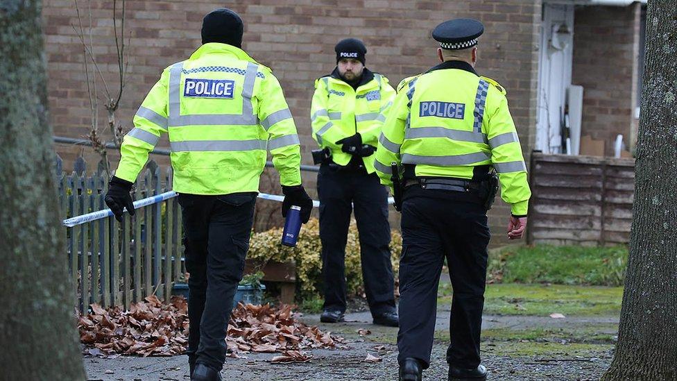 Police officers at crime scene