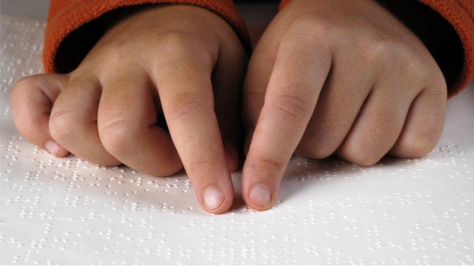 Child using braille