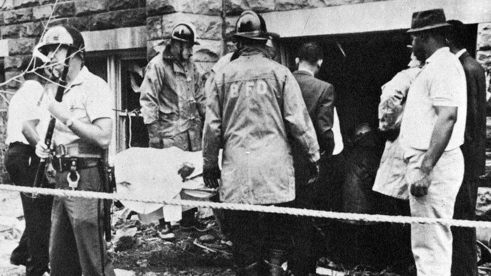 A victim is removed from the site of the Baptist Church Bombing