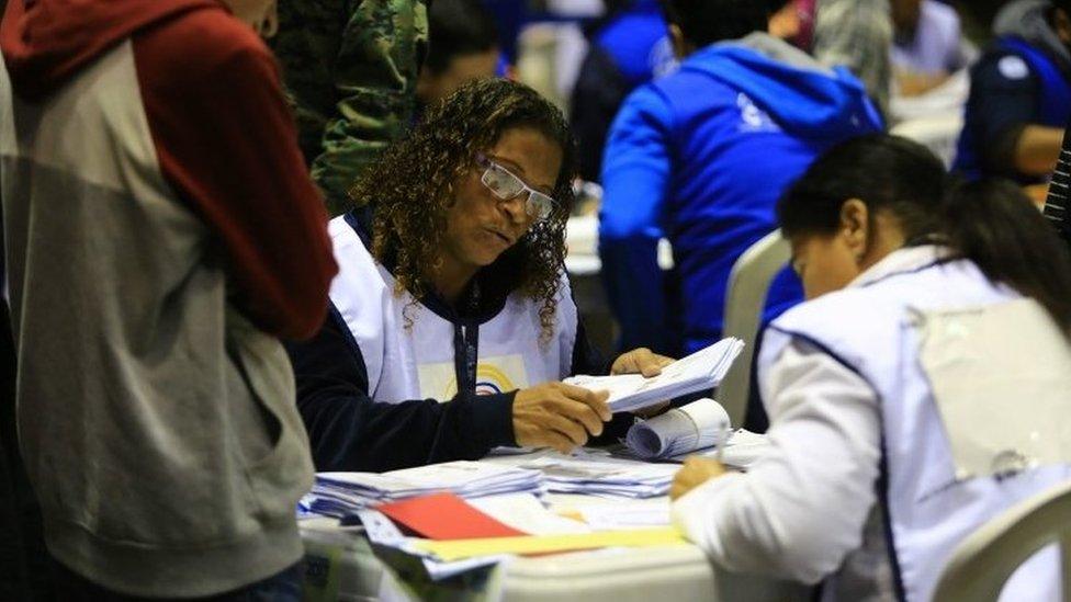 Officials of the National Electoral Council (CNE) participate in the recounting of votes of the second round of the last presidential elections in Quito, Ecuador, on 18 April 2017.