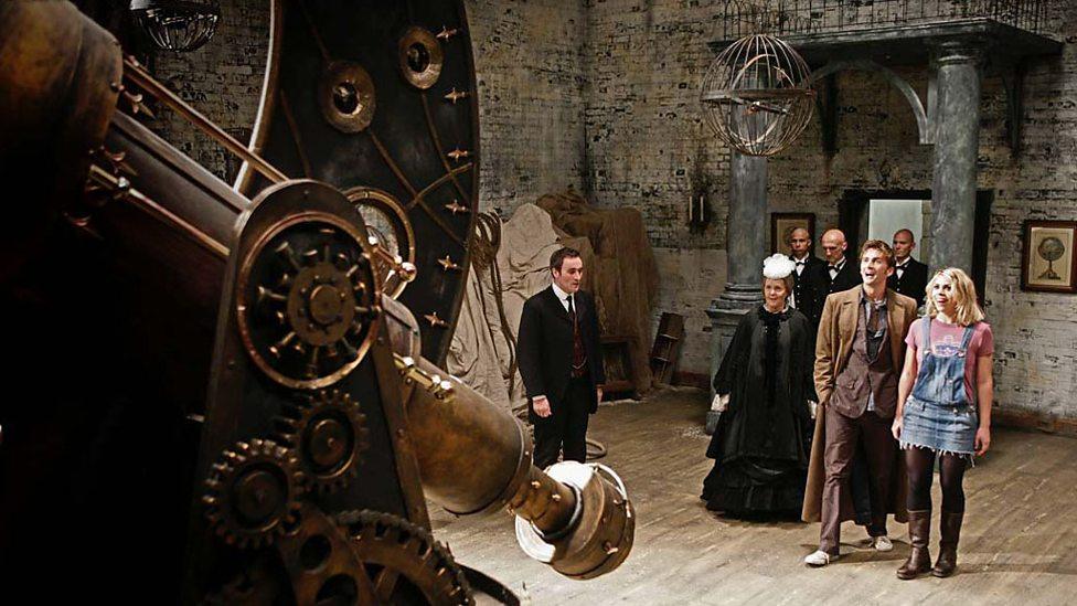 A scene from Doctor Who, There's an old castle featuring five people in the period costume as well as Dr Who (David Tennant) and his assistant (Billie Piper)