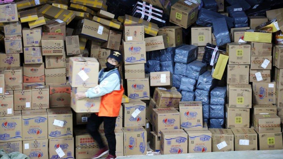 Staff sorting through parcels after Singles Day last year