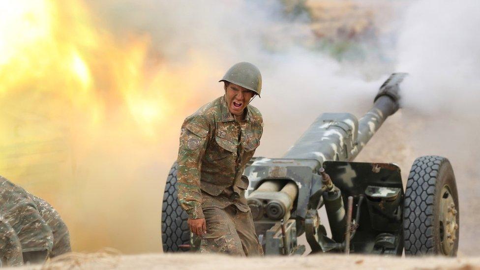 A handout photo made available by the Armenian Defense Ministry on 30 September 2020 on its official website shows Armenian soldier during military clashes