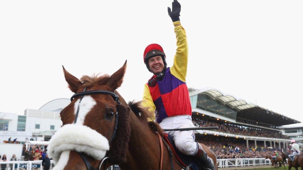 Richard Johnson on Native River celebrates after winning the Timico Cheltenham Gold Cup Chase during Gold Cup Day at Cheltenham Racecourse on March 16, 2018