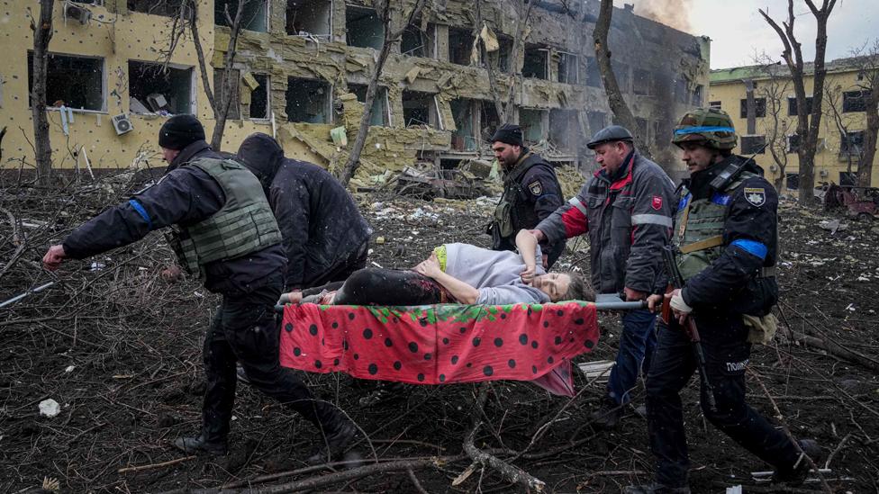 Pregnant woman on a stretcher in Mariupol