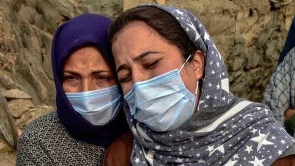 Wife of slain Mudasir Gull weeps and pleads during a protest demanding the return of the bodies of Altaf and Mudasir Gull