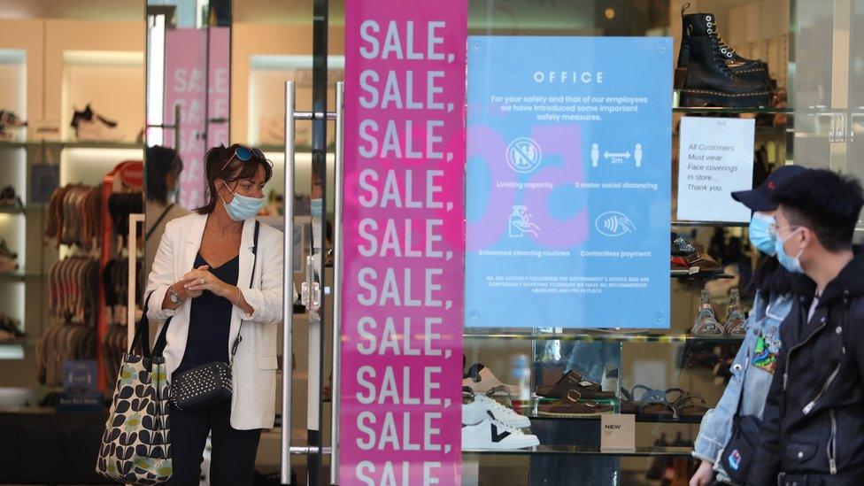 A person wears a mask in a shop in Buchanan Street in Glasgow as it became compulsory to wear face coverings in shops as Scotland continues with the gradual lifting of restrictions to ease out of lockdown.