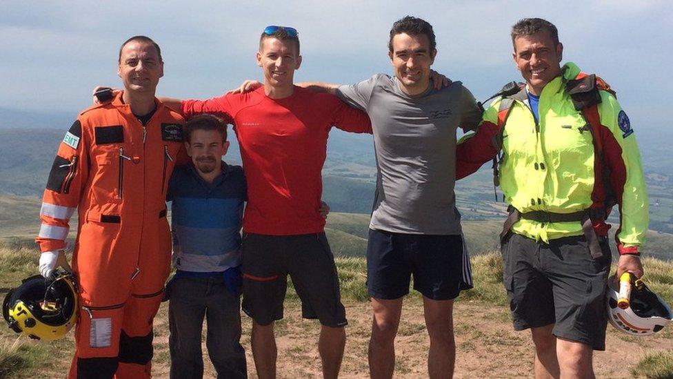 Graham Hatch of HM Coastguard, Rory McCann, Finn McCann, Niall McCann and Mark Jones returning to the site of Mr McCann's accident